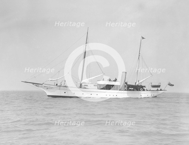 The steam yacht 'Titania' under way, 1911. Creator: Kirk & Sons of Cowes.