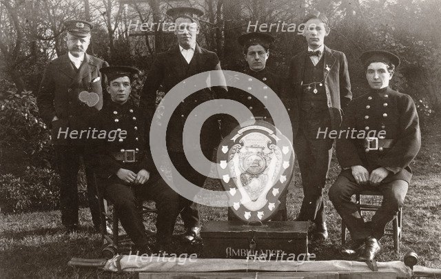 Members of the winning Rowntree Ambulance Team pose with trophy, York, Yorkshire, 24 Jan 1914. Artist: Unknown