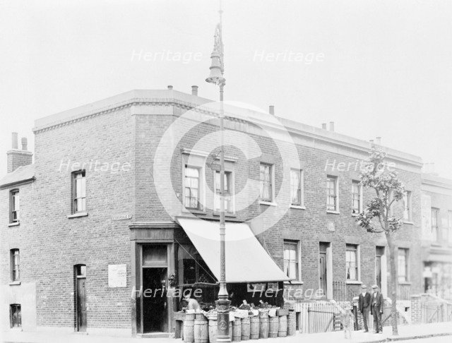 A greengrocer's shop on a street corner. Artist: Unknown