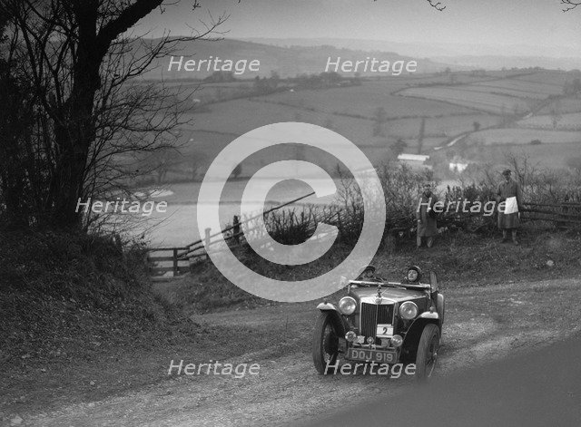MG TA of JL Lutwyche competing in the MG Car Club Midland Centre Trial, 1938. Artist: Bill Brunell.