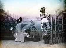 Japanese girls playing in a garden, 1880. Creator: Unknown.