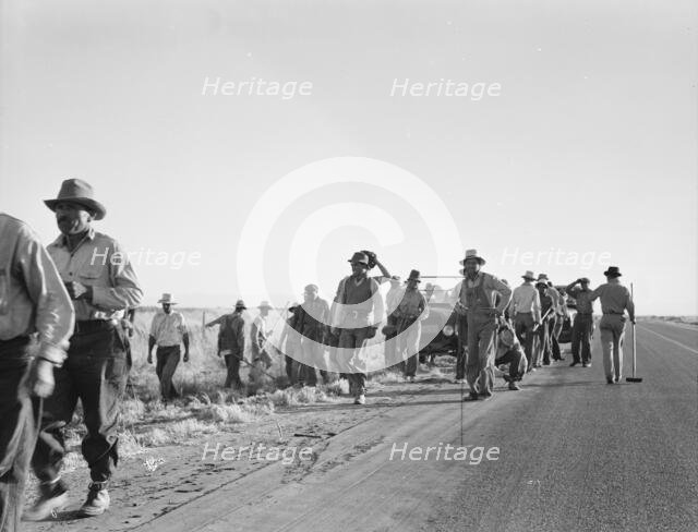 Migratory agricultural workers - cotton hoers, near Los Banos, California, 1939. Creator: Dorothea Lange.