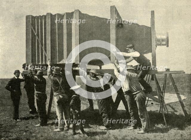 'Focussing The Gigantic Camera For Work', 1901. Creator: Unknown.
