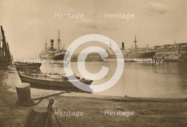 'Carriers of London's Food: Unloaded Cargo Boats in the South Dock of the West India Docks', c1935. Creator: Langfier.