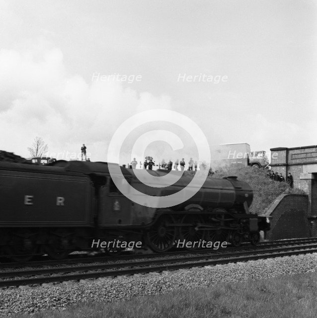 The 'Flying Scotsman' passing under a bridge at speed, near Selby, North Yorkshire, 1968. Artist: Michael Walters