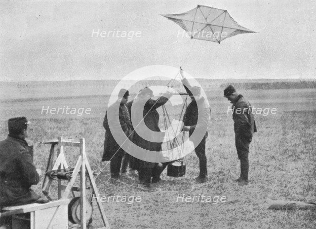 'Sending up one of the French war kites, to which a camera is attached', 1914, (1915). Artist: Unknown.