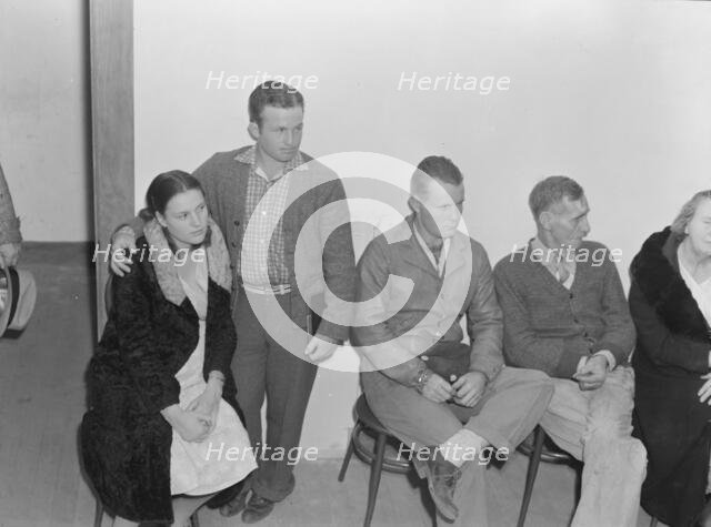 Night meeting in the FSA office, Visalia, Tulare County, California, 1938. Creator: Dorothea Lange.