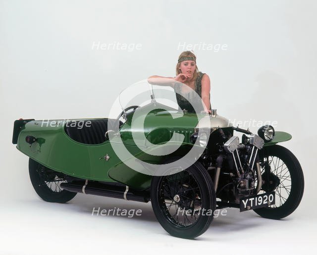 1927 Morgan Aero 3 wheeler with female "flapper" model. Creator: Unknown.