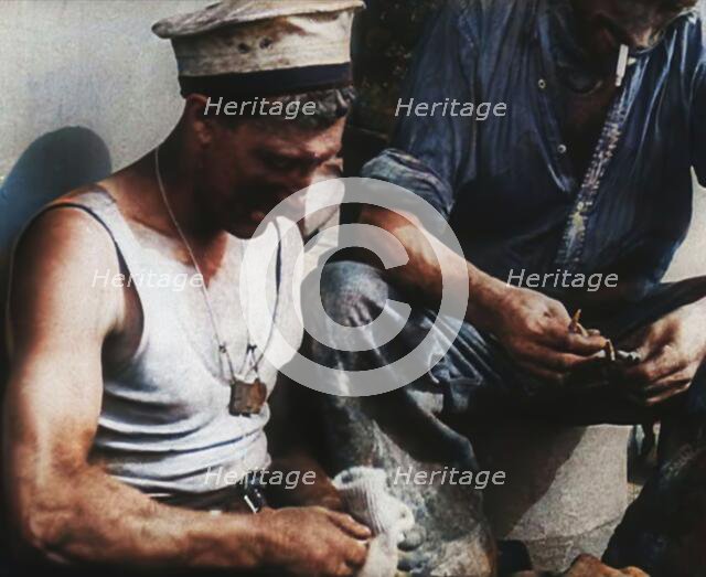 British Soldier Counting Bullets on Board a Ship Evacuating Him from Dunkirk, 1940. Creator: British Pathe Ltd.