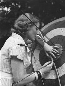 Chase, Diana, Miss, doing archery, 1933 June 22. Creator: Arnold Genthe.