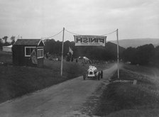 Unidentified offset single-seater car finishing the Shelsley Walsh Hillclimb, Worcestershire, 1935. Artist: Bill Brunell.