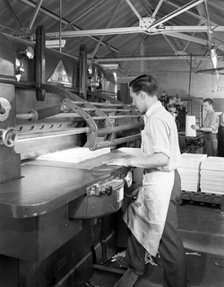 Page cutting guillotine in use at a South Yorkshire printing company, 1959.  Artist: Michael Walters