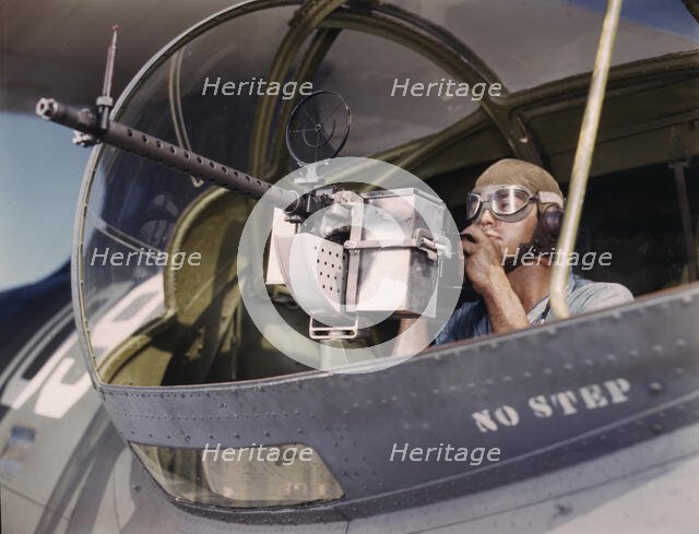Jesse Rhodes Waller, A.O.M., third class, tries out a 30-calibre...Corpus Christi, Texas, 1942. Creator: Howard Hollem.