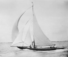Unknown cutter sailing with spinnaker. Creator: Kirk & Sons of Cowes.