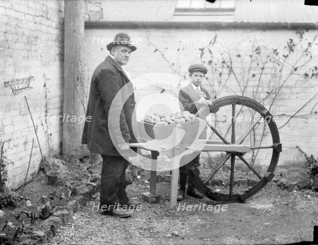 A man holding his potato planting invention, 1900. Artist: Henry Taunt