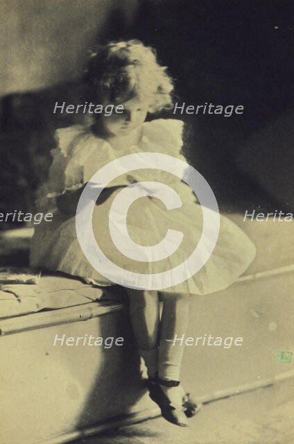 Seated girl reading a book, c1900. Creator: Eva Watson-Schutze.