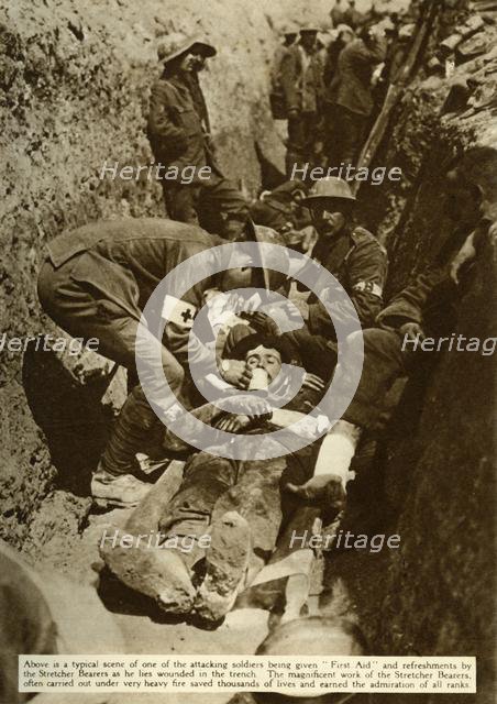 Wounded soldier being treated in the trenches, Battle of the Somme, First World War, 1916, (1935). Creator: Unknown.