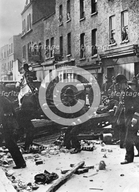 Police dismantle an anti-Fascist barricade, East London, 4th October 1936. Artist: Unknown