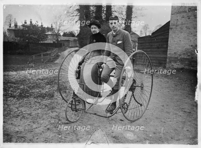 Man and a woman sitting on a double tricycle, England, c1890. Creator: Unknown.