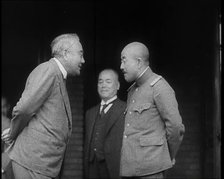 A Male Japanese Politician and a Male Military Leader Talking Together While Another Male..., 1937. Creator: British Pathe Ltd.