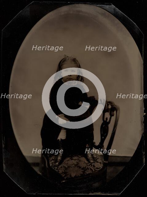 Portrait of a Little Girl Standing on a Chair, 1870s. Creator: Unknown.