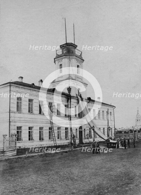 Irkutsk police fire brigade. Exercise with a rescue sheet and a rescue basket, 1894. Creator: R Prorokov.