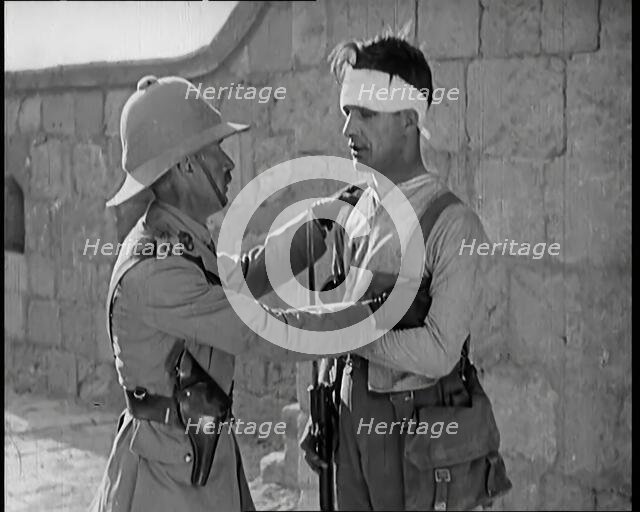 Scene from a Film: Male Actor Playing a Survivor from the Battle Being Questioned..., 1920s. Creator: British Pathe Ltd.