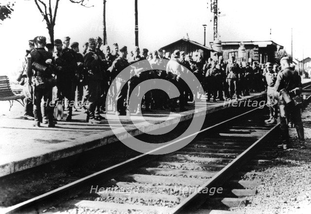 German soldiers on a railway platform awaiting transport, Paris, August 1940. Artist: Unknown