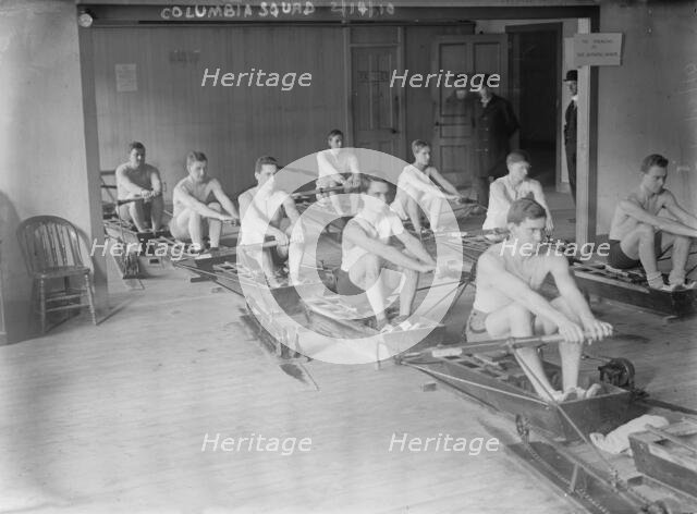 Columbia crew team in mock shells practicing in club house, 1910. Creator: Bain News Service.