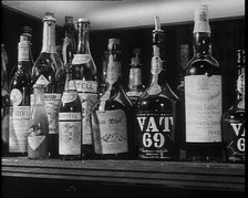 Row of Spirits Lined up on a Shelf, 1933. Creator: British Pathe Ltd.