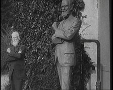 Playwright George Bernard Shaw Standing Next To a Statue of Himself, 1920s. Creator: British Pathe Ltd.