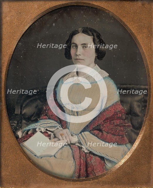 Seated Young Woman Wearing a Shawl, Holding an Open Book in her Lap, 1850s. Creator: Unknown.