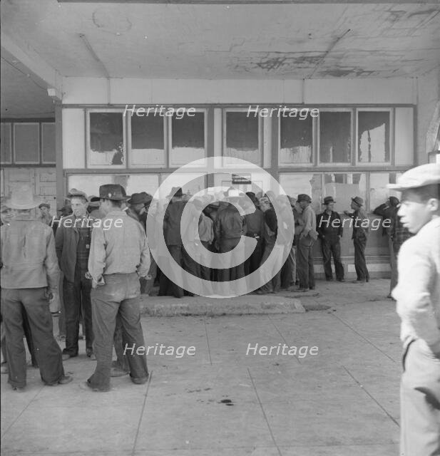 Outside FSA grant office during the pea harvest, Calipatria, California, 1939. Creator: Dorothea Lange.