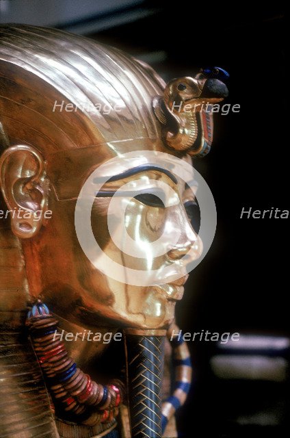 Gold mask of Tutankhamun on the second coffin. Artist: Unknown