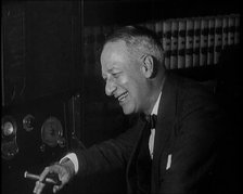 Al Smith, Former Presidential Candidate, Smoking a Cigar And Following Election Results..., 1932. Creator: British Pathe Ltd.