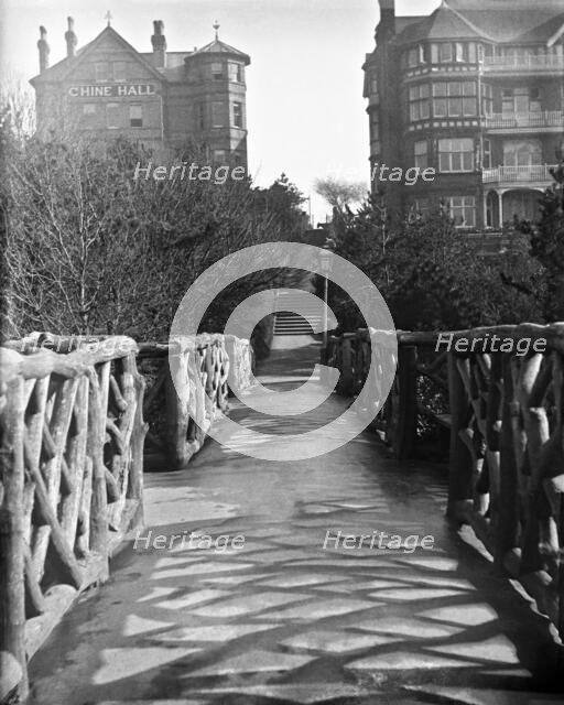 Chine Hall and White Lodge Hotel from the Rustic Bridge, Boscombe Chine and Gardens..., 1900. Creator: Robert Augustus Henry L'Estrange.