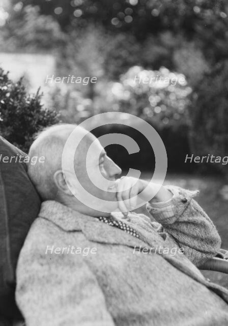 Clucas, E.W., seated outdoors, 1931 June 14. Creator: Arnold Genthe.