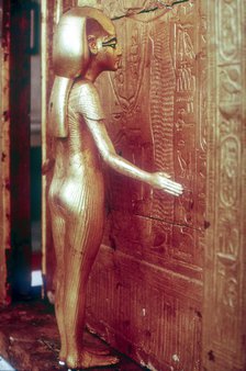 Isis the protective goddess guarding the Canopic Shrine, Tomb of Tutankhamun, Cairo. Artist: Unknown