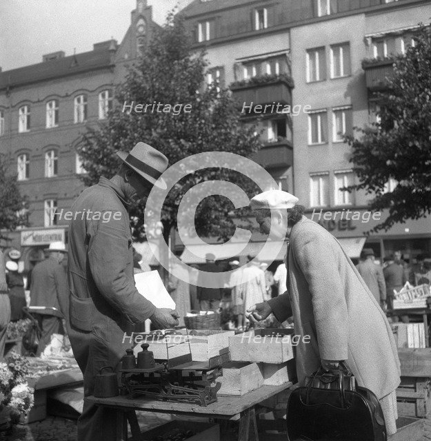 Scene in the market, Malmö, Sweden, 1947. Artist: Otto Ohm