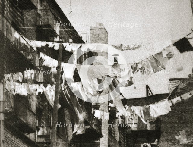 Wash day at some New York tenement buildings, USA, early 1930s. Artist: Unknown