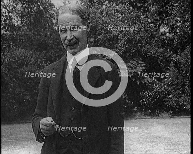 Lord Privy seal Andrew Bonar Law Standing in a Garden, 1921. Creator: British Pathe Ltd.
