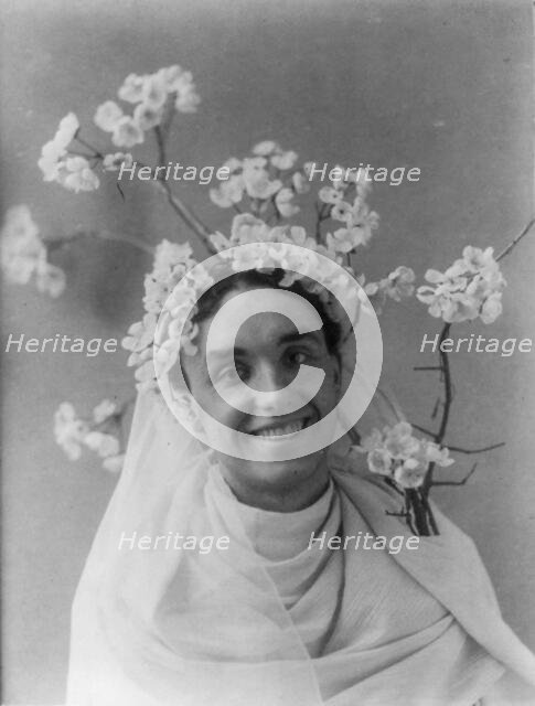 Mills Thompson, head-and-shoulders portrait, facing right, with cherry..., between c1890 and c1910. Creator: Frances Benjamin Johnston.