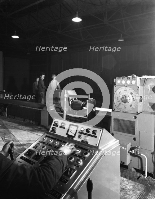A continuous forge in operation at the Edgar Allen Steel Founders, Meadowhall, Sheffield, 1962.  Artist: Michael Walters
