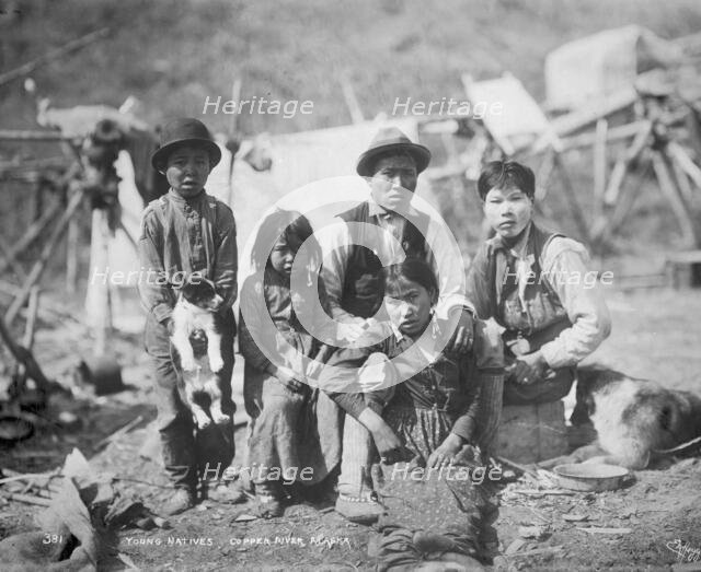 Cordova natives and dogs, between c1906 and 1915. Creator: Eric A. Hegg.