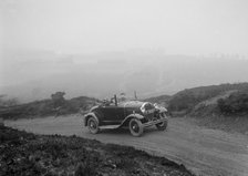 Kitty Brunell driving a 1930 2-seater Ford Model A, 1931.   Artist: Bill Brunell.