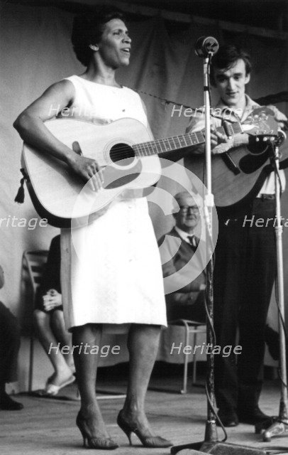 Nadia Cattouse and Martin Carthy, folk concert at Parliament Hill Fields, London, early 1960s.  Artist: Eddis Thomas