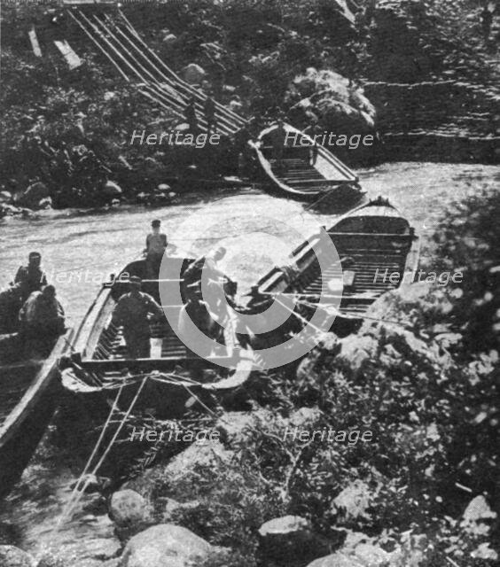 Italian Offensive of the Isonzo; boats are launched into the current slowed down by a dam, 1917. Creator: Unknown.