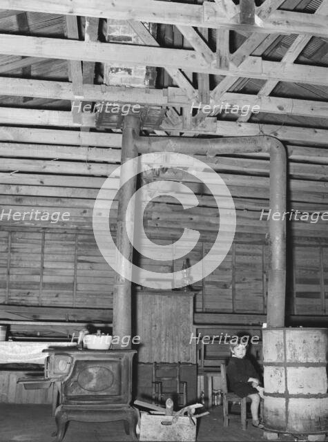 Stoves in former country church now used as residence, near Laurel, Mississippi, 1939. Creator: Dorothea Lange.
