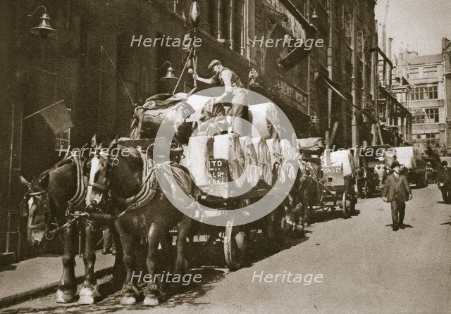 Hoisting the paper into a newspaper office, 20th century. Artist: Unknown
