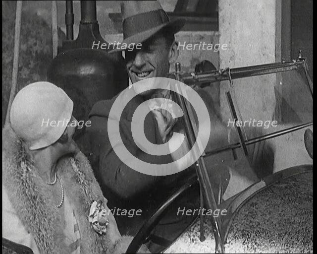 Jack Hulbert Climbing Into a Car And Getting His Fingers Stuck in Windscreen, 1920s. Creator: British Pathe Ltd.